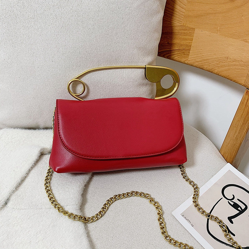 RedLeather safety -pin handle cross body bag | Clutch Fate 